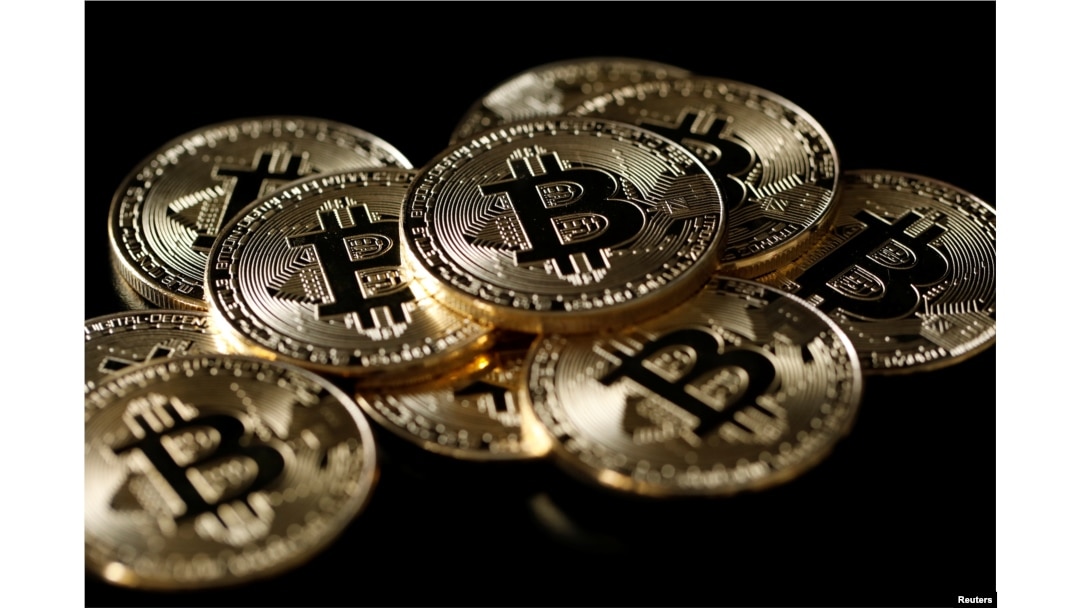 A collection of Bitcoin (virtual currency) tokens are displayed in this illustration taken Dec. 8, 2017.