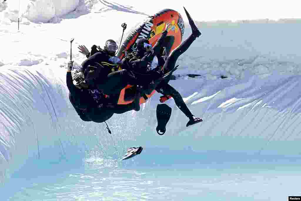 People participate in the Red Bull Jump &amp; Freeze Lebanon at Mzaar Kfardebian Ski Resort in mount Lebanon.