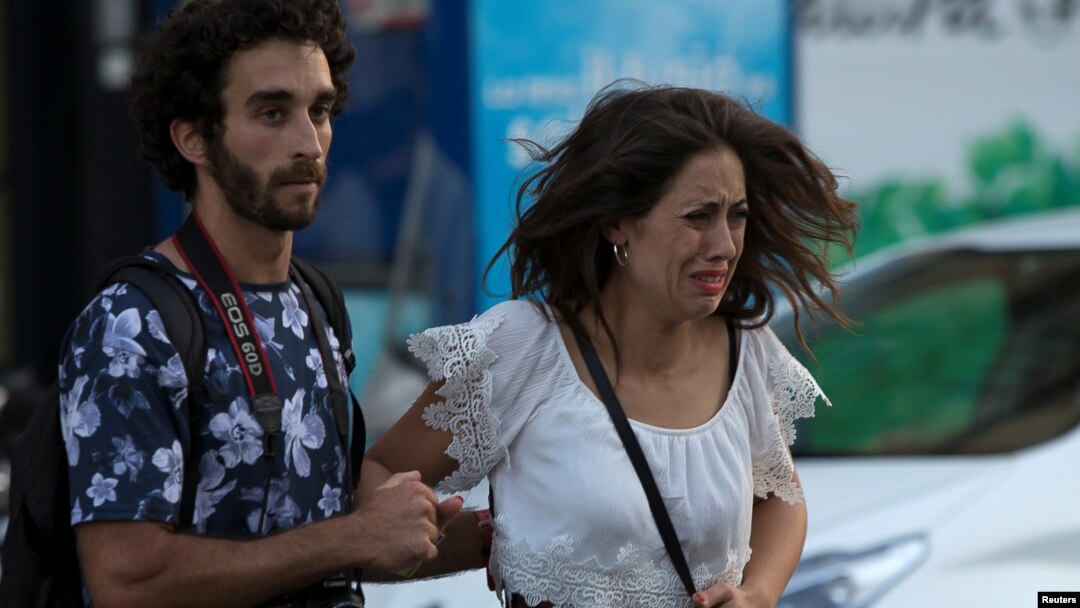Police (not pictured) evacuate people after a van crashed into pedestrians near the Las Ramblas avenue in central Barcelona, Spain, Aug. 17, 2017.