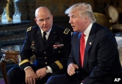 FILE - President Donald Trump, right, speaks as Army Lt. Gen. H.R. McMaster, left, listens at Trump's Mar-a-Lago estate in Palm Beach, Florida, Feb. 20, 2017, where Trump announced that McMaster will be the new national security adviser.