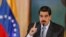 Venezuela's President Nicolas Maduro gestures as he speaks during a news conference in Caracas, Venezuela, Sept. 30, 2019. 