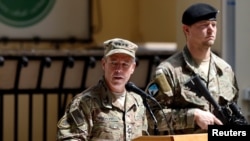 FILE - Commander of U.S. and NATO forces in Afghanistan, U.S. Army General Scott Miller, speaks during a change of command ceremony in Kabul, Afghanistan, Sept. 2, 2018.