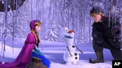 This image released by Disney shows, from left, Anna, voiced by Kristen Bell, Olaf, voiced by Josh Gad, and Kristoff, voiced by Jonathan Groff in a scene from the animated feature "Frozen." (AP Photo/Disney)