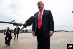 U.S. President Donald Trump speaks to reporters before boarding Air Force One for travel to Indianapolis, Indiana, at Joint Base Andrews, Maryland, outside Washington, D.C, April 26, 2019.