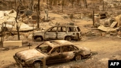 This photo shows cars burned in the Ranch Fire, part of the Mendocino Complex Fire, in Spring Valley near Clearlake Oaks, a city in northern California, Aug. 7, 2018. 