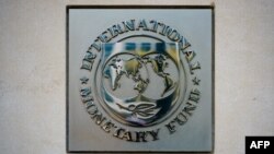FILE: The logo of the International Monetary Fund (IMF) is seen outside of a headquarters building in Washington, DC. Taken April 7, 2021.