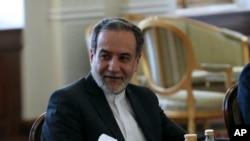 FILE - Iranian Foreign Minister Abbas Araghchi attends a meeting with Qatari Prime Minister and Foreign Minister Sheikh Mohammed bin Abdulrahman Al Thani, in Tehran, Iran, Aug. 26, 2024.