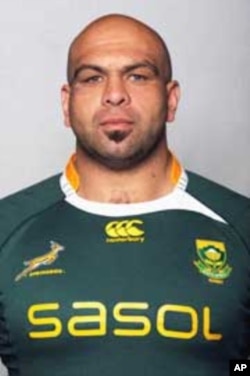Current South Africa rugby player, Gurthro Steenkamp, in a modern-day Springbok jersey, with the distinctive emblem of a leaping antelope on the left side of his shirt