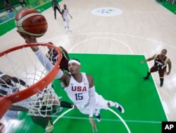 United States' Carmelo Anthony (15) scores against Venezuela during a men's basketball game at the 2016 Summer Olympics in Rio de Janeiro, Brazil, Aug. 8, 2016.