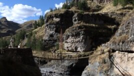 Members of the Huinchiri community rebuild an Incan hanging bridge using traditional weaving techniques in Canas, Peru, June 13, 2021. Cusco Regional Government/Handout via REUTERS