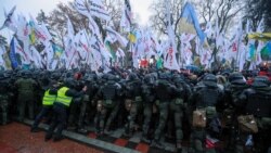 Ukrainian law enforcement officers block demonstrators during a rally held by entrepreneurs and representatives of small businesses near the parliament building amid the coronavirus disease (COVID-19) outbreak in Kyiv, Ukraine November 17, 2020.