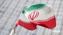 The Iranian flag flutters in front the International Atomic Energy Agency (IAEA) headquarters in Vienna, Austria, July 10, 2019.