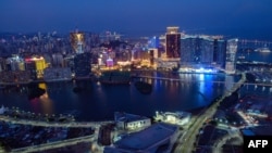 (FILES) This file photo taken on January 30, 2020 shows a general view of Macau city from the observation deck of Macau Tower.