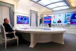 FILE - Russian President Vladimir Putin takes part in a virtual meeting with leaders of the Collective Security Treaty Organization to discuss the situation in Afghanistan, in Moscow, Russia, Aug. 23, 2021.