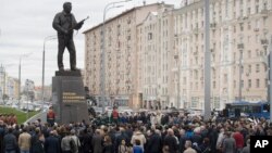 A monument to Russian firearm designer Mikhail Kalashnikov is unveiled during a ceremony in Moscow, Russia, Sept. 19, 2017.