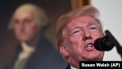 U.S. -- President Donald Trump speaks in the Diplomatic Reception Room of the White House on Friday, April 13, 2018, in Washington, about the United States' military response to Syria's chemical weapon attack on April 7.