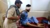  An injured man receives a treatment at the hospital, after a suicide attack in Jalalabad, Afghanistan, June 13, 2019.