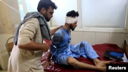  An injured man receives a treatment at the hospital, after a suicide attack in Jalalabad, Afghanistan, June 13, 2019.