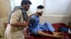 An injured man receives a treatment at the hospital, after a suicide attack in Jalalabad, Afghanistan, June 13, 2019.