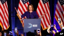 House Minority Leader Nancy Pelosi of Calif., smiles as she is cheered by a crowd of Democratic supporters during an election night returns event at the Hyatt Regency Hotel, on Nov. 6, 2018, in Washington.