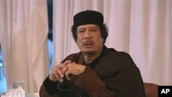 This image taken from Libya State TV shows Libyan leader Moammar Gadhafi, March 15, 2011
