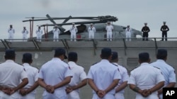 Cambodian naval troops welcome the USS Savannah as it arrives for a port call at Sihanoukville port, Cambodia, Dec. 16, 2024.