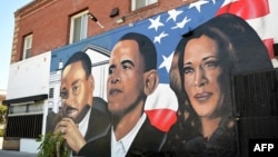 A mural by artist "4eene Vision" depicting US minister and activist Martin Luther King Jr. (L), former US President Barack Obama (C) and US Vice President and 2024 Democratic presidential candidate Kamala Harris (R) is pictured in Los Angeles, California 