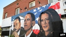 A mural by artist "4eene Vision" depicting US minister and activist Martin Luther King Jr. (L), former US President Barack Obama (C) and US Vice President and 2024 Democratic presidential candidate Kamala Harris (R) is pictured in Los Angeles, California