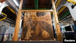 FILE - The "Adoration of the Magi", a massive painting that Leonardo da Vinci started in 1481 at the age of 29 but abandoned a year later, leaving it in various stages of conception and development, is unveiled in Florence September 23, 2014. 