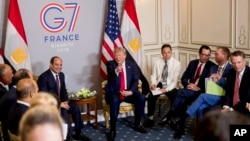 President Donald Trump speaks during a bilateral meeting with Egyptian President Abdel Fattah al-Sissi, left, at the G-7 summit in Biarritz, France, Monday, Aug. 26, 2019.
