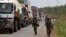 African Union (AU) peacekeepers guard a commercial convoy making its way to the border of Cameroon, near Bangui, March 8, 2014.