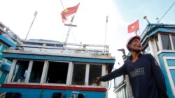 资料照：一名越南渔民和他的渔船