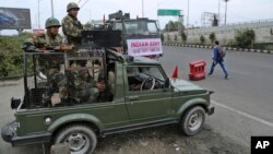 Indian army soldiers vigil during the fourth consecutive day of curfew in Jammu, the winter capital of Jammu and Kashmir state, India, Feb.18, 2019.