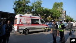 FILE - Police officers secure the area after a suicide bomb explosion outside the historical Ulu Cami in Bursa, Turkey, Wednesday, April 27, 2016. 