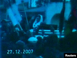 A television still released on December 28, 2007, one day after her assassination, shows former Pakistan prime minister Benazir Bhutto moments before she died following a rally in Rawalpindi.