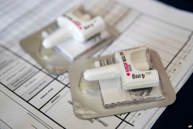 FILE -A Narcan nasal device which delivers naloxone lies on a counter as a health educator gives instructions on how to administer it in the Brooklyn borough of New York, July 3, 2018.