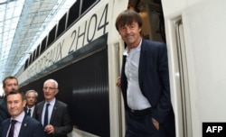 French Minister of Ecological and Inclusive Transition Nicolas Hulot steps off a train next to the head of the French national state-owned railway company SNCF, Guillaume Pepy, center back, during the inauguration of a new TGV high-speed train line linking Paris to Bordeaux at the Bordeaux-Saint-Jean train station, July 1, 2017.