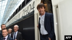French Minister of Environment Nicolas Hulot steps off a train next to the head of the French national state-owned railway company SNCF, Guillaume Pepy.