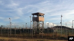 This Dec. 11, 2016, photo shows an unused guard tower at Camp Delta, one of the parts of the detention center at the U.S. naval base at Guantanamo Bay, Cuba, that is now vacant as the detainee population reaches 59, the lowest it has been since early 2002.