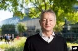 FILE - Computer scientist Geoffrey Hinton, who studies neural networks used in artificial intelligence applications, poses at Google's Mountain View, Calif, headquarters on Wednesday, March 25, 2015.