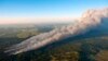 An aerial photo shows wildfire burning homes in Black Forest community near Colorado Springs, Colorado, June 11, 2013.