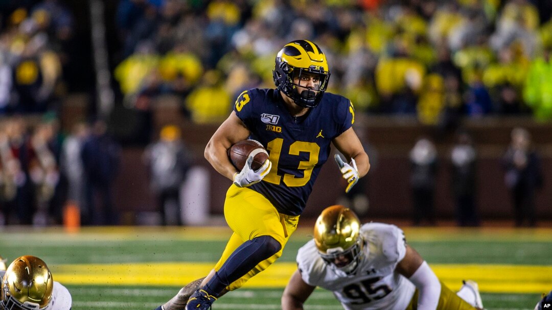 FILE - Michigan running back Tru Wilson rushes 27 yards for a touchdown in an NCAA college football game against Notre Dame in Ann Arbor, Mich., Oct. 26, 2019. 