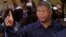 Angola's MPLA main ruling party candidate and defense minister, Joao Lourenco, shows his ink-stained finger after casting his vote in Luanda, Angola, Aug. 23, 2017. Lourenco is the front-runner to succeed President Jose Eduardo dos Santos, who will step down after 38 years in power in an oil-rich country.