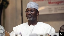 FILE - Nigeria's ex-electoral chief and academic Attahiru Jega attends a meeting with staff from the Independent National Electoral Commission in Abuja, March 17, 2011. 