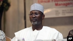 Nigeria's electoral chief and academic Attahiru Jega attends a meeting with staff from the Independent National Electoral Commission in Abuja, March 17, 2011. (AP Image)