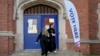 Voters depart a polling place at McDonald Elementary School, Nov. 5, 2024, in Dearborn, Michigan.