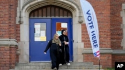 Voters depart a polling place at McDonald Elementary School, Nov. 5, 2024, in Dearborn, Michigan.