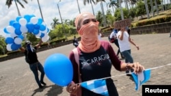 ARCHIVO- Manifestantes en Nicaragua participan en una protesta contra el gobierno del presidente Daniel Ortega en Managua. Septiembre 9, de 2019.