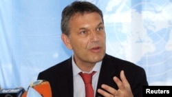 FILE - U.N. Humanitarian Coordinator for Somalia Philippe Lazzarini addresses a news conference at the United Nations offices in Somalia's capital Mogadishu, May 2, 2013. 