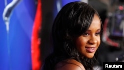 FILE - Bobbi Kristina Brown, daughter of the late singer Whitney Houston, poses at the premiere of "Sparkle" in Hollywood, California, August 16, 2012. 
